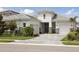 Beautiful single-Gathering home with a well-manicured lawn and two-car garage, showing great curb appeal at 17721 Roost Pl, Lakewood Ranch, FL 34211