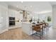 Bright kitchen featuring white cabinets, stainless appliances, a decorative backsplash, and a large center island at 17721 Roost Pl, Lakewood Ranch, FL 34211