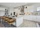 Beautiful kitchen featuring a spacious island with bar seating, stainless steel appliances, and ample cabinet space at 17721 Roost Pl, Lakewood Ranch, FL 34211