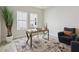 Bright office features ample natural light and a cozy seating area, perfect for a productive workspace at 17721 Roost Pl, Lakewood Ranch, FL 34211
