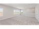 Spacious bonus room with ample natural light and carpet at 17725 Roost Pl, Lakewood Ranch, FL 34211