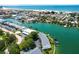 Aerial view showcasing the community's waterfront access, lush landscaping, and proximity to the beach at 12246 2Nd E St # 503, Treasure Island, FL 33706