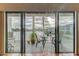 A beautiful outdoor balcony offers a cozy spot to relax, enhanced by outdoor furniture and scenic water views at 12246 2Nd E St # 503, Treasure Island, FL 33706