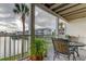 Balcony with comfortable seating and a waterfront view overlooking the canal and community at 12246 2Nd E St # 503, Treasure Island, FL 33706
