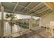 Balcony view overlooking the water, with a palm tree and seating for relaxing outdoors at 12246 2Nd E St # 503, Treasure Island, FL 33706