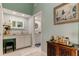 Elegant bathroom with dual vanities, decorative mirrors, and a connecting doorway to another bathroom at 12246 2Nd E St # 503, Treasure Island, FL 33706