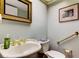 Half bath featuring decorative mirror and artwork, with grab bars for added safety at 12246 2Nd E St # 503, Treasure Island, FL 33706