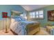 Light-filled bedroom with a bed, large window and a large mirror to create spaciousness at 12246 2Nd E St # 503, Treasure Island, FL 33706