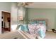 Bright bedroom with a ceiling fan, a comfortable bed and a plush throw at 12246 2Nd E St # 503, Treasure Island, FL 33706