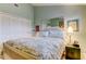 Bright bedroom with a bed, and a corner filled with closet and decor at 12246 2Nd E St # 503, Treasure Island, FL 33706