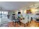 Open-concept dining room adjacent to the living room with modern decor and natural light at 12246 2Nd E St # 503, Treasure Island, FL 33706