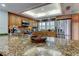 Updated kitchen featuring a granite countertop, stainless steel appliances, and custom cabinetry at 12246 2Nd E St # 503, Treasure Island, FL 33706