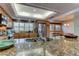 A large granite island anchors this kitchen, complete with custom cabinets and modern stainless steel appliances at 12246 2Nd E St # 503, Treasure Island, FL 33706