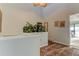 The landing area features a plant, animal print rug, and artwork, offering style and charm at 12246 2Nd E St # 503, Treasure Island, FL 33706