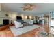 Bright open floor plan featuring a fireplace, comfortable seating, and tiled floors at 12246 2Nd E St # 503, Treasure Island, FL 33706