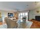 Inviting living room featuring stylish furnishings, a fireplace, and sliding glass doors to a balcony at 12246 2Nd E St # 503, Treasure Island, FL 33706