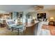 An inviting living room boasts terra cotta floors, neutral furniture, and artful decor for relaxation and style at 12246 2Nd E St # 503, Treasure Island, FL 33706