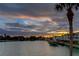 Scenic waterfront view at sunset with docks, boats, and beautiful buildings along the canal at 12246 2Nd E St # 503, Treasure Island, FL 33706