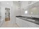 Luxurious bathroom featuring double sinks and a stylish mirror, adjacent to a spa-like tub and closet at 2355 Bahia Vista St, Sarasota, FL 34239