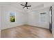 Bedroom with hardwood floors, ceiling fan, large windows and contemporary trim at 2355 Bahia Vista St, Sarasota, FL 34239