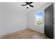 Bedroom featuring hardwood floors, ceiling fan, and large windows at 2355 Bahia Vista St, Sarasota, FL 34239