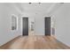Expansive bedroom featuring hardwood floors and tray ceilings, connecting to adjacent rooms through elegant doorways at 2355 Bahia Vista St, Sarasota, FL 34239