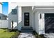 Modern home featuring a sleek front door, gray paver steps, and minimalist landscaping at 2355 Bahia Vista St, Sarasota, FL 34239
