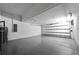 Spacious garage with epoxy floor and modern doors and hardware at 2355 Bahia Vista St, Sarasota, FL 34239