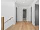 Bright hallway with hardwood flooring, leading to multiple rooms, promoting an open floor plan at 2355 Bahia Vista St, Sarasota, FL 34239