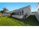 Modern house exterior with a lush green lawn at 2355 Bahia Vista St, Sarasota, FL 34239