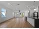 Bright, airy living room with hardwood floors and large windows at 2355 Bahia Vista St, Sarasota, FL 34239