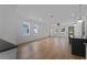 Bright, airy living room with hardwood floors and large windows at 2355 Bahia Vista St, Sarasota, FL 34239