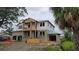 Two-story home under construction, showing its block construction, framing, and blue roof sheathing at 567 Luzon Ave, Tampa, FL 33606