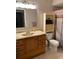 Bathroom with updated vanity, toilet and shower with curtain at 10911 Hachita Dr, Port Richey, FL 34668