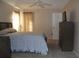 Spacious bedroom with a ceiling fan and large bed at 10911 Hachita Dr, Port Richey, FL 34668