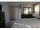 Main bedroom with a dresser, closet, and plush bedding at 10911 Hachita Dr, Port Richey, FL 34668