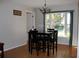 Dining area with a window overlooking the backyard at 10911 Hachita Dr, Port Richey, FL 34668