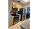 Kitchen boasts stainless steel appliances and granite countertops at 10911 Hachita Dr, Port Richey, FL 34668