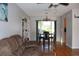 Combined living and dining area with hardwood floors and ample natural light at 10911 Hachita Dr, Port Richey, FL 34668