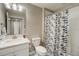 Clean bathroom with shower/tub combo, white vanity, and tile flooring at 31396 Cabana Rye Ave, San Antonio, FL 33576