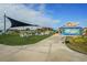 Relaxing outdoor space with artificial turf, shade structures, and seating at 31396 Cabana Rye Ave, San Antonio, FL 33576