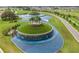 Aerial view of community with a central water feature and landscaping at 31396 Cabana Rye Ave, San Antonio, FL 33576