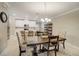 Open dining room with a large table and view of the kitchen at 31396 Cabana Rye Ave, San Antonio, FL 33576