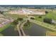 Aerial view of community lake and surrounding landscape at 31396 Cabana Rye Ave, San Antonio, FL 33576