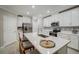 Modern kitchen with white cabinets and a large island at 31396 Cabana Rye Ave, San Antonio, FL 33576