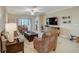 Living room with comfortable seating and a large TV at 31396 Cabana Rye Ave, San Antonio, FL 33576