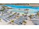 Expansive aerial view of resort-style lagoon, beach, and numerous lounge chairs at 31396 Cabana Rye Ave, San Antonio, FL 33576