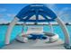 Inflatable lounge with shade canopy in lagoon at 31396 Cabana Rye Ave, San Antonio, FL 33576