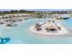 Aerial view of crystal-clear lagoon with sandy beach and water features at 31396 Cabana Rye Ave, San Antonio, FL 33576