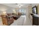 Spacious living room with comfy seating, large TV, and access to patio at 31396 Cabana Rye Ave, San Antonio, FL 33576